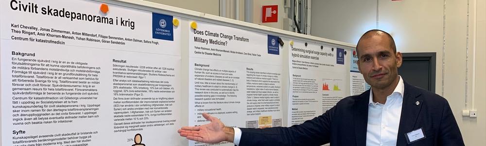 Yohan Robinson, CKM's director shows some of our posters at NKMK 2023 in Linköping