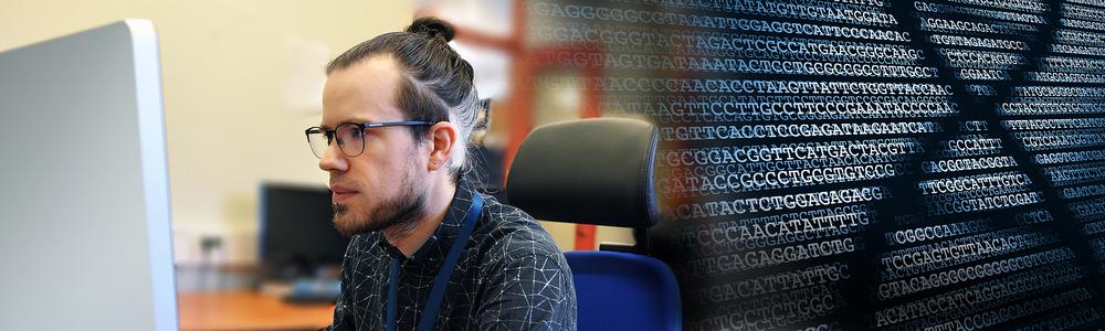 Researcher working at the computer as well as a picture of a DNA sequence.